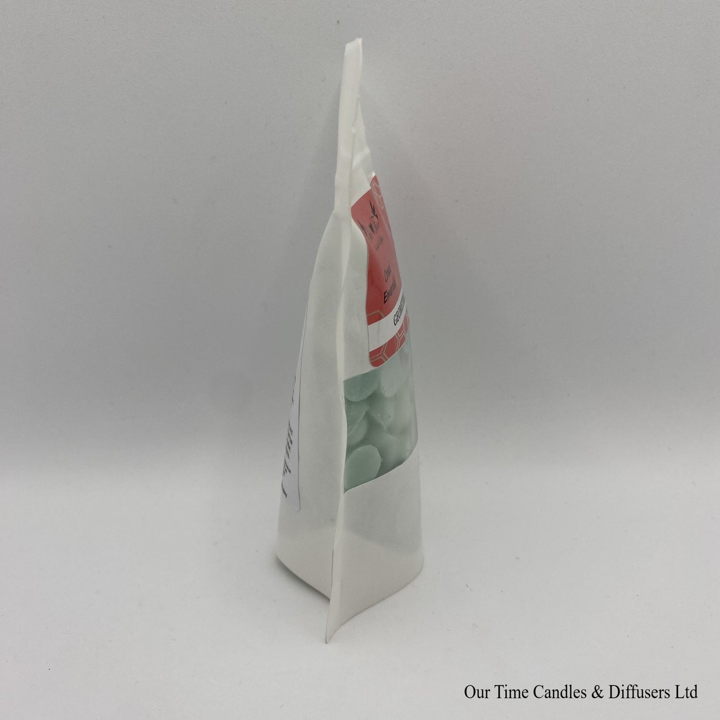 Creed Emerald Inspired scented soy wax melt drops in a white bag