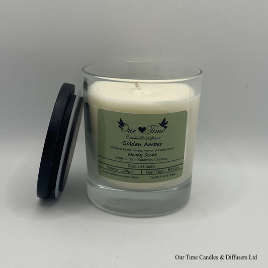 Large wax filled scented candle with black lid