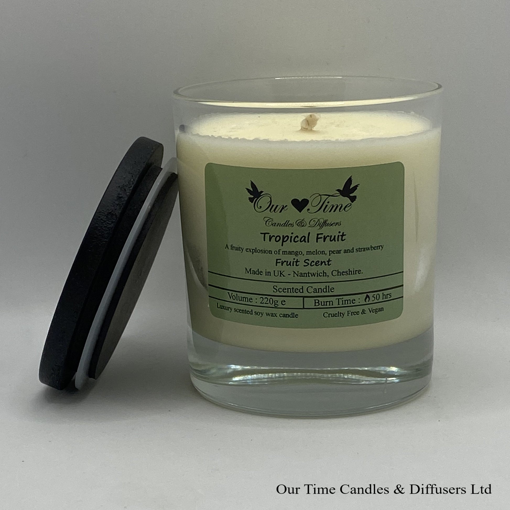 Large vegan soy scented candle with black lid off