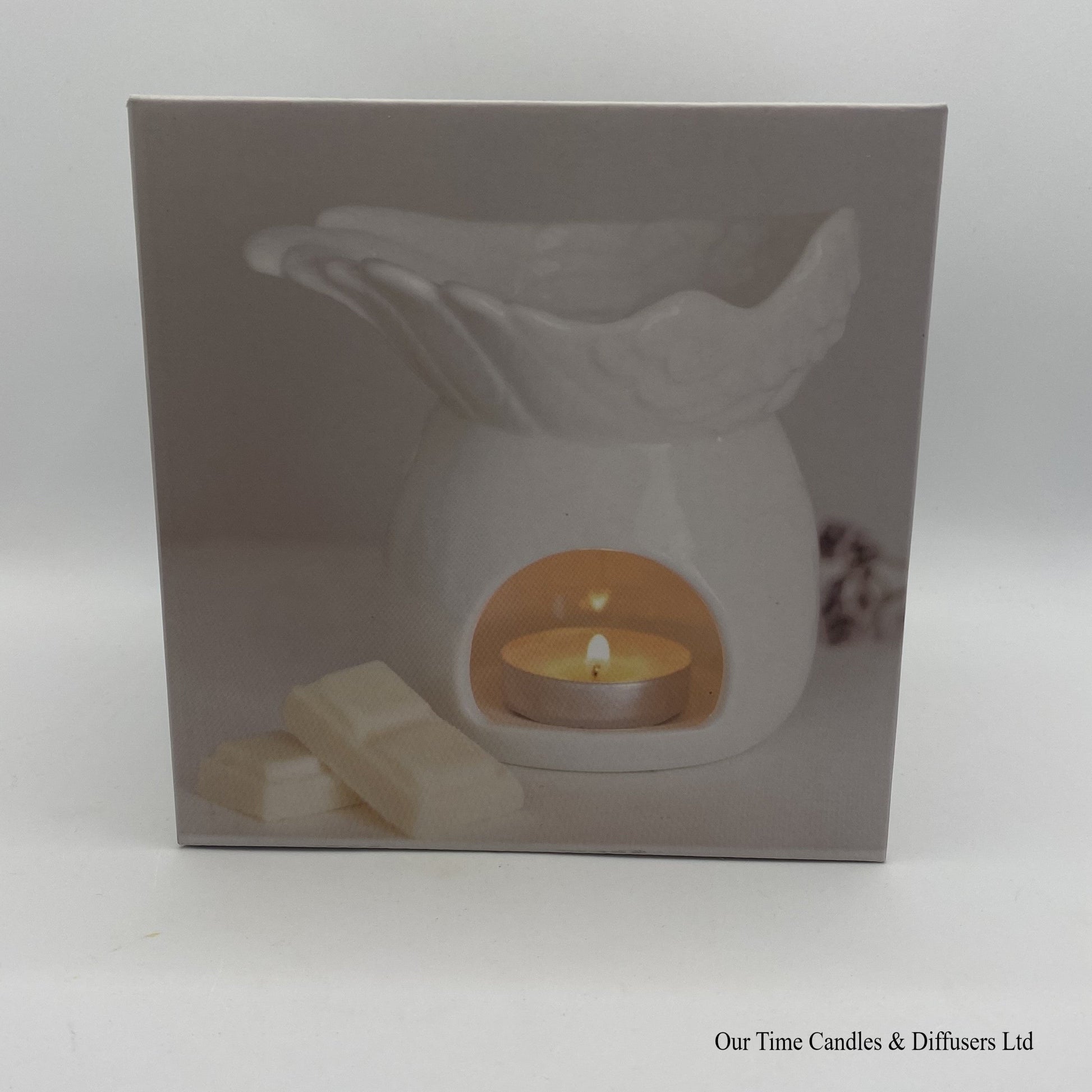 Gift box with front photo showing the angel wings wax Burner in use.