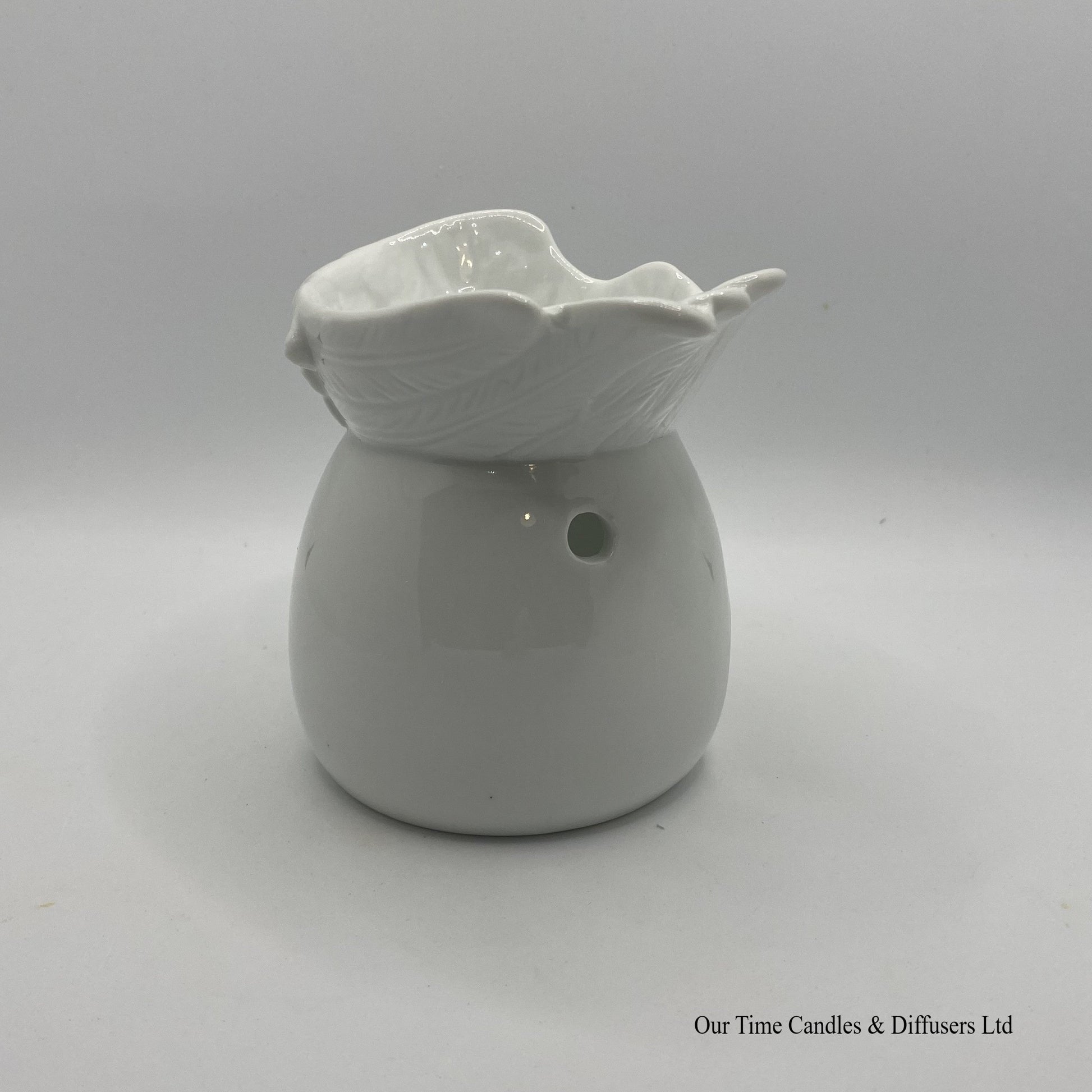 Side view of our Angel Wings Wax Burner with large melt bowl.