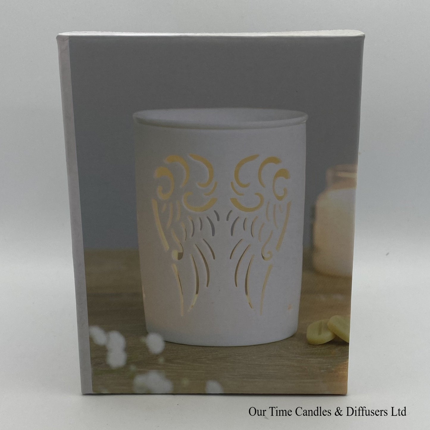 View of the display box our Angel Wings cut-out wax burner in white ceramic. A perfect gift.