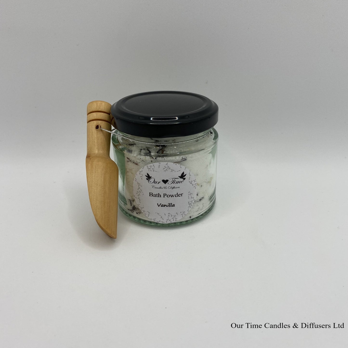 Bath Powder - Vanilla product image showing filled jar with black lid and wooden scoop