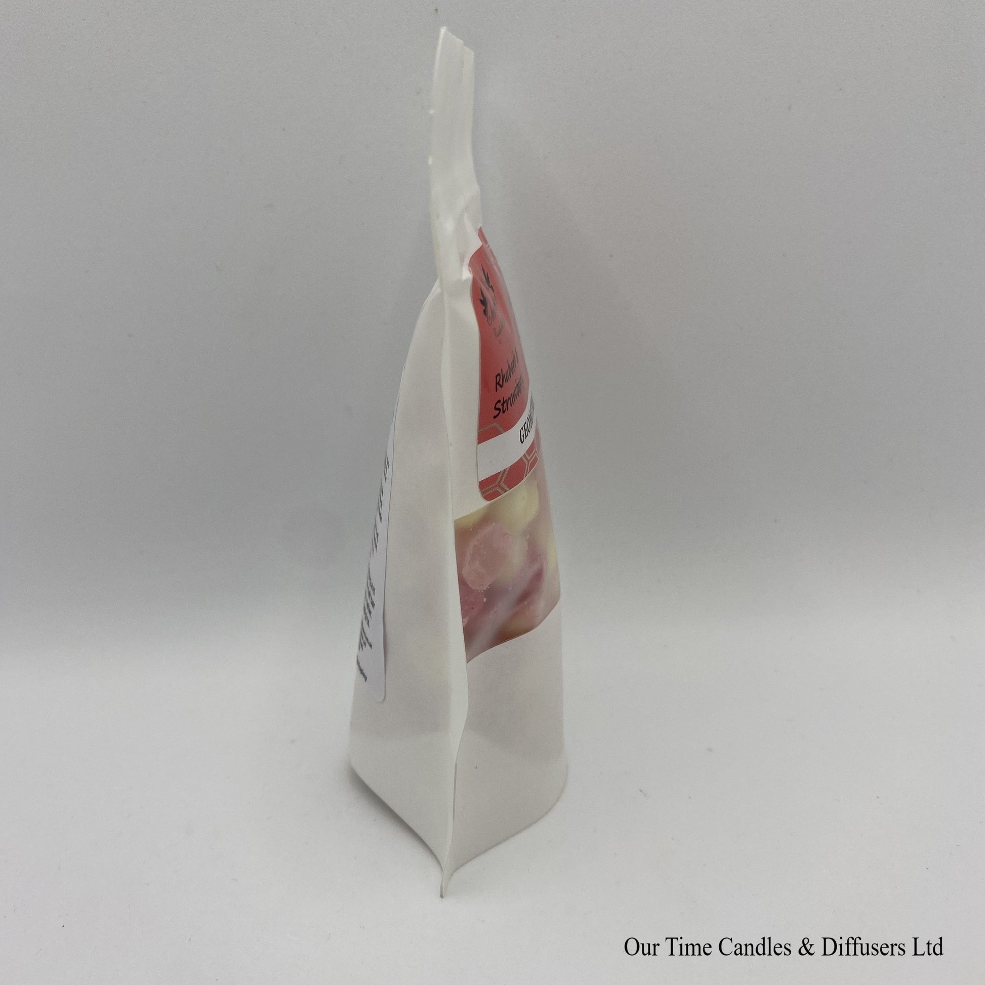 Rhubarb & Strawberry scented soy wax melt drops in a white bag