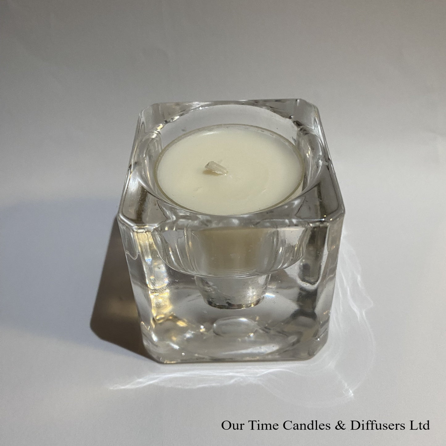Clear tealight candle holder with tea light